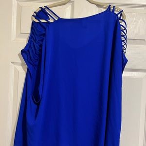 Deep blue top with shoulder slits. Chiffon type material